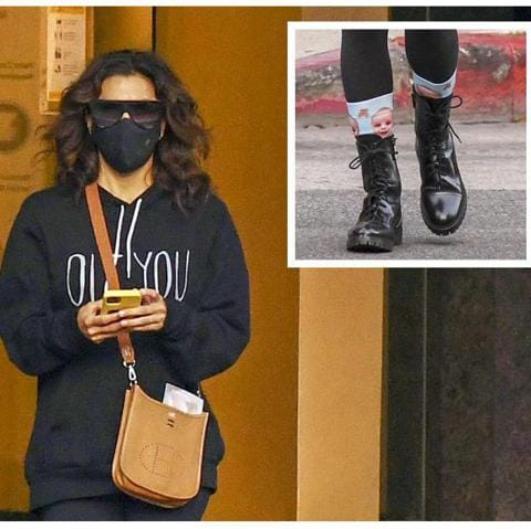 Eva Longoria wears cute socks with her son's face on them