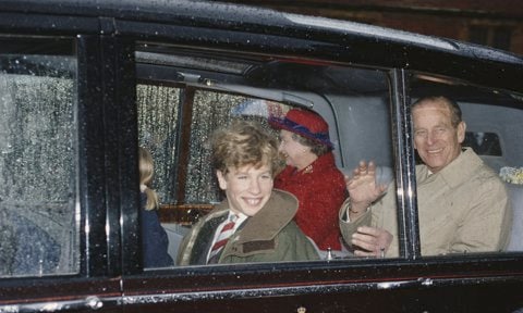 The Duke was all smiles riding in the car with his grandson as he and the Queen visited Peter and Zara Phillips’ school in 1991.